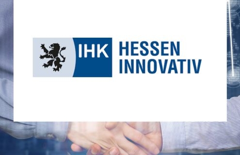 Logo der IHK Hessen Innovativ mit Löwenwappen, blauem Schriftzug und Handschlag im Hintergrund – Symbol für wirtschaftliche Zusammenarbeit und Innovationsförderung.